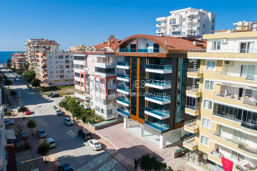 Apartament 2+1 z meblami i częściowym widokiem na morze — Alanya, dzielnica Mahmutlar  1 