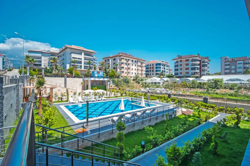 1+1 umeblowane mieszkanie w Alanya, Kestel - 150 m do morza, przeszklony balkon  4 