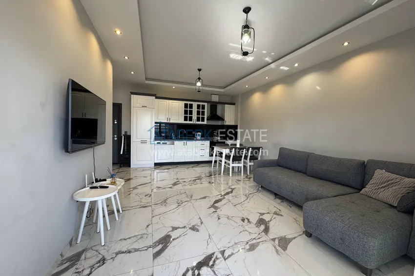 Kupuj  1+1 umeblowane mieszkanie w Alanya, Kestel - 150 m do morza, przeszklony balkon  6 