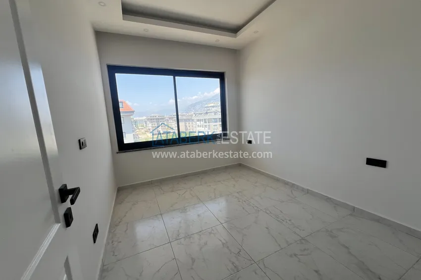Kupuj  Duplex 2+1 w Kargicak, 250 metrów od plaży - dwupoziomowy penthouse z widokiem na morze 11 