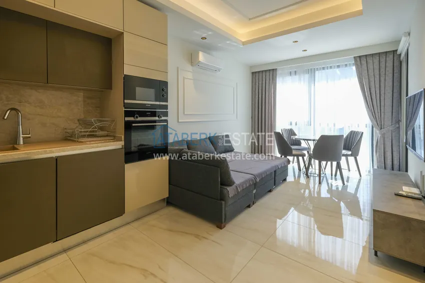 Kupuj  Apartament 1+1 przy plaży w Mahmutlar — umeblowany i z panoramicznym widokiem na morze 1 