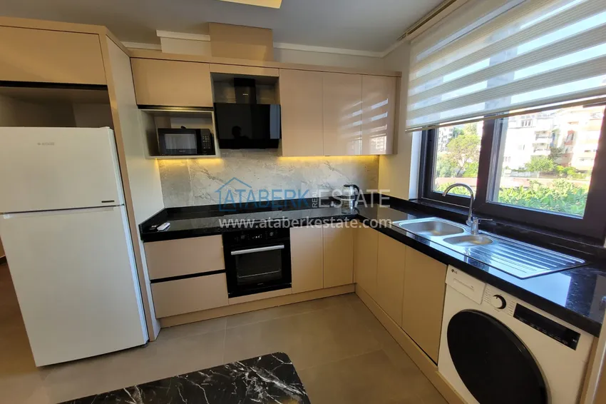 Kupuj  Wykończony apartament z dwiema sypialniami w kompleksie w budowie w Mahmutlar 10 