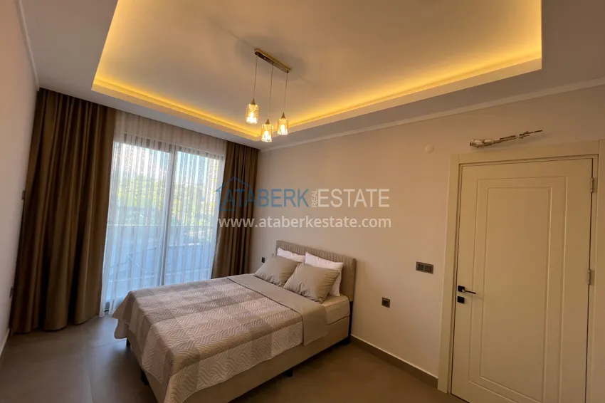 Kupuj  Wykończony apartament z dwiema sypialniami w kompleksie w budowie w Mahmutlar 12 