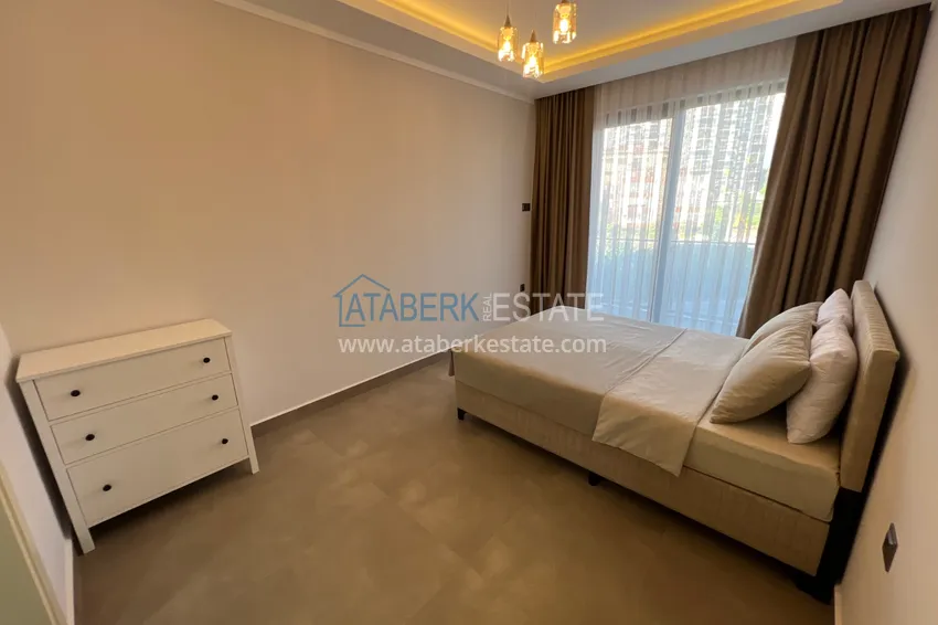 Kupuj  Wykończony apartament z dwiema sypialniami w kompleksie w budowie w Mahmutlar 13 