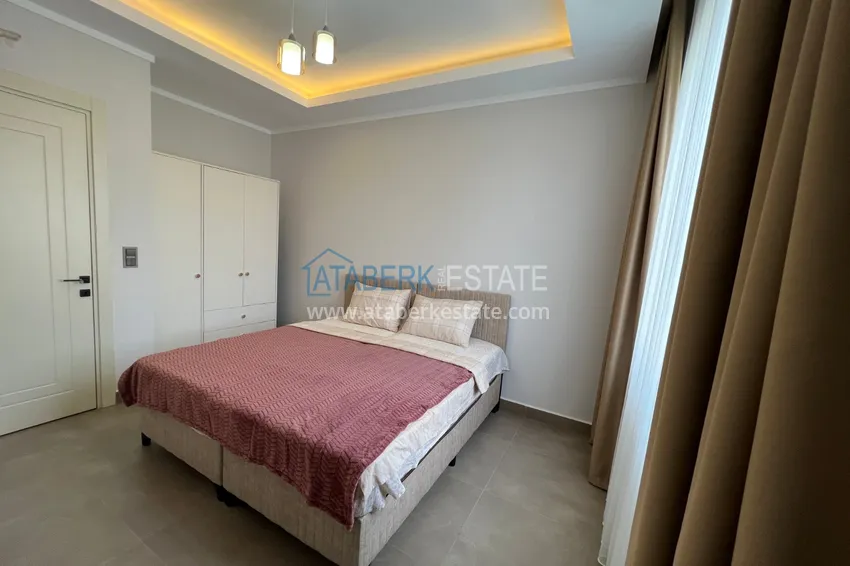 Kupuj  Wykończony apartament z dwiema sypialniami w kompleksie w budowie w Mahmutlar 16 