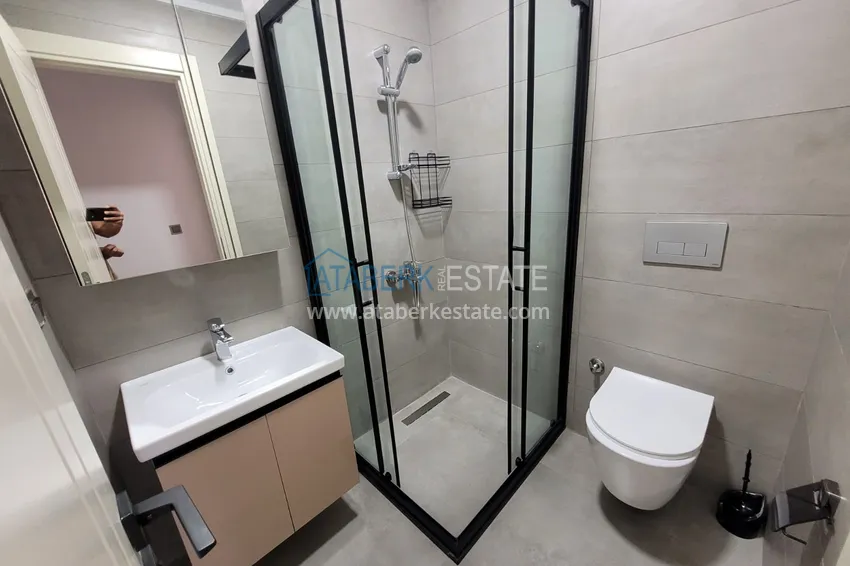 Kupuj  Wykończony apartament z dwiema sypialniami w kompleksie w budowie w Mahmutlar 18 
