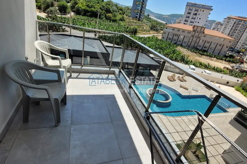 Kupuj  Wykończony apartament z dwiema sypialniami w kompleksie w budowie w Mahmutlar 19 