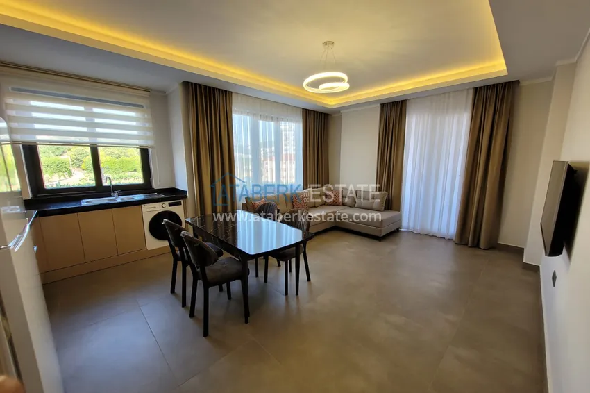 Kupuj  Wykończony apartament z dwiema sypialniami w kompleksie w budowie w Mahmutlar 4 