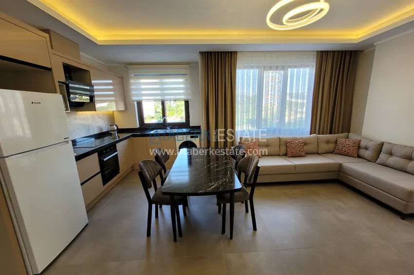 Kupuj  Wykończony apartament z dwiema sypialniami w kompleksie w budowie w Mahmutlar 7 