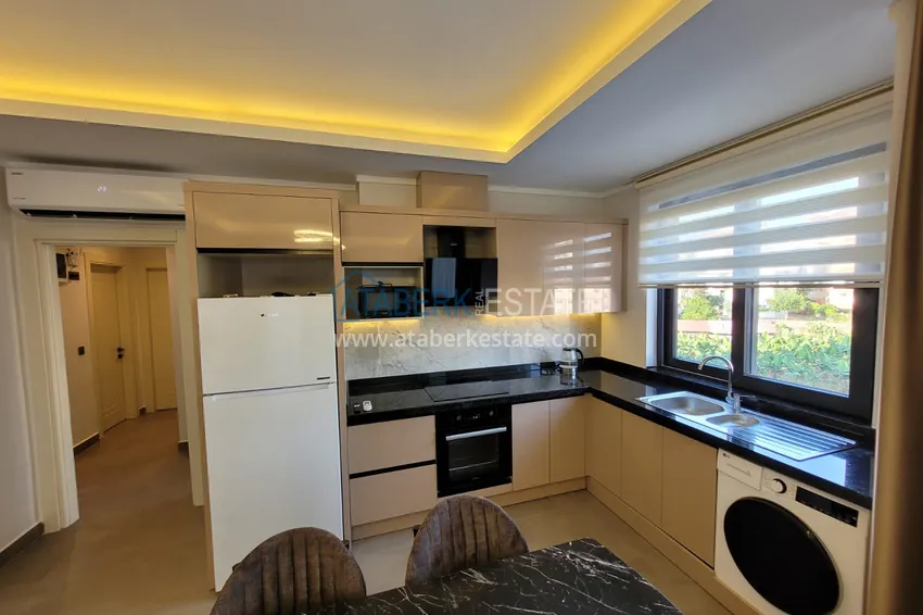 Kupuj  Wykończony apartament z dwiema sypialniami w kompleksie w budowie w Mahmutlar 8 