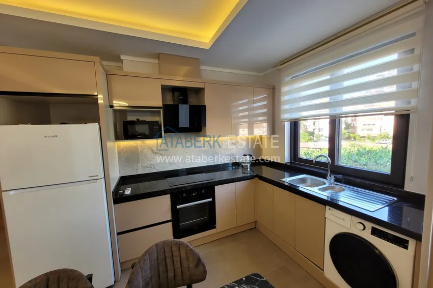 Kupuj  Wykończony apartament z dwiema sypialniami w kompleksie w budowie w Mahmutlar 9 