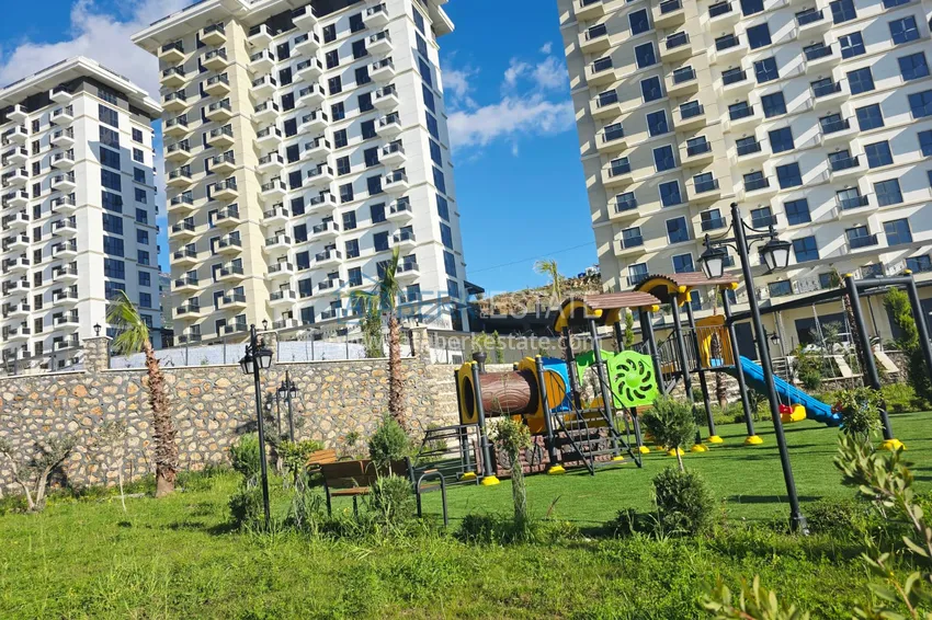 Oferta inwestorska: Apartament z jedną sypialnią i widokiem na góry w kompleksie premium — Alanya, Mahmutlar 13 