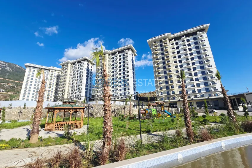 Oferta inwestorska: Apartament z jedną sypialnią i widokiem na góry w kompleksie premium — Alanya, Mahmutlar 16 