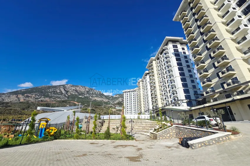 Oferta inwestorska: Apartament z jedną sypialnią i widokiem na góry w kompleksie premium — Alanya, Mahmutlar 17 