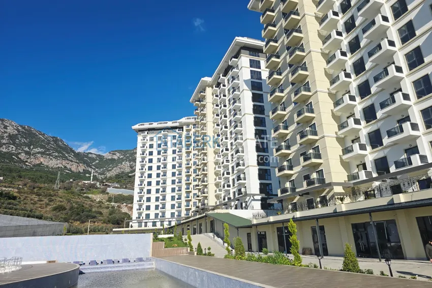 Oferta inwestorska: Apartament z jedną sypialnią i widokiem na góry w kompleksie premium — Alanya, Mahmutlar 4 