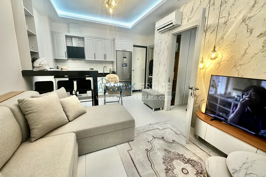 Kupuj  Apartament z jedną sypialnią w Alanya, dzielnica Oba - umeblowany i z przeszklonym balkonem  1 