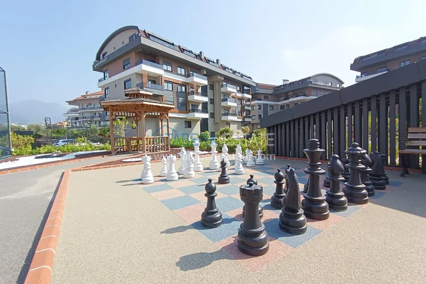 Apartament z jedną sypialnią w Alanya, dzielnica Oba - umeblowany i z przeszklonym balkonem  15 