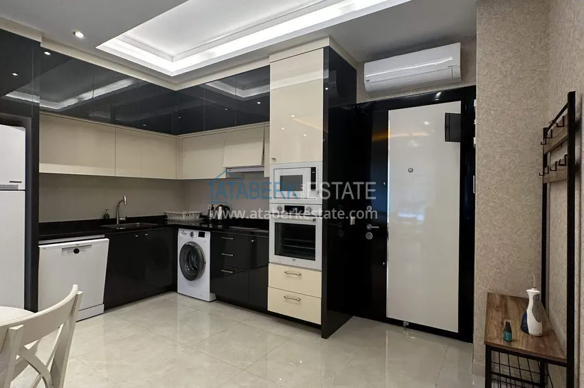 Kupuj  1+1 mieszkanie 70 m² w centrum Mahmutlar — umeblowane, przeszklony balkon, raty do 1 roku 3 