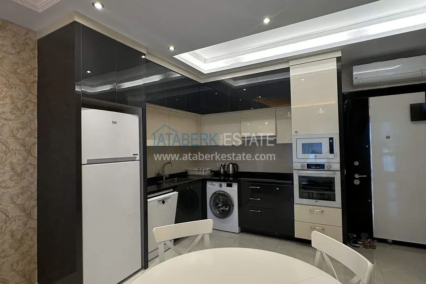 Kupuj  1+1 mieszkanie 70 m² w centrum Mahmutlar — umeblowane, przeszklony balkon, raty do 1 roku 5 