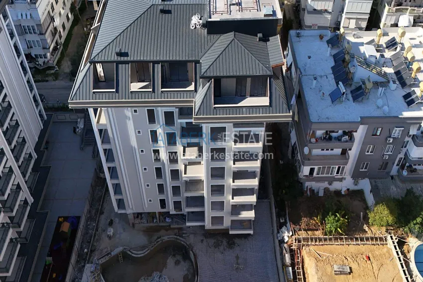 Nowy projekt inwestycyjny kompleksu mieszkalnego z bogatą infrastrukturą w centrum Alanyi 12 