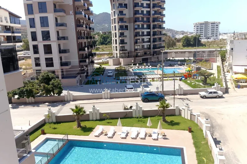 Kupuj  Apartament 1+1 w Gazipasa z pięknym wykończeniem w nowoczesnym kompleksie 10 