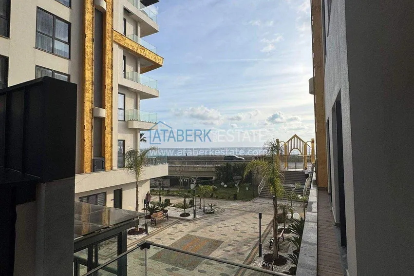 Kupuj  Apartament 1+1 w pierwszej linii w Mahmutlar — umeblowany i z widokiem na morze w pięciogwiazdkowym kompleksie hotelowym 10 