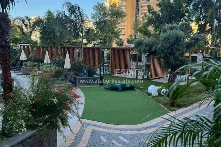 Apartament 1+1 w pierwszej linii w Mahmutlar — umeblowany i z widokiem na morze w pięciogwiazdkowym kompleksie hotelowym 19 