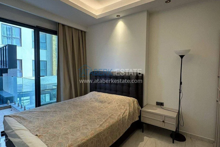 Kupuj  Apartament 1+1 w pierwszej linii w Mahmutlar — umeblowany i z widokiem na morze w pięciogwiazdkowym kompleksie hotelowym 5 