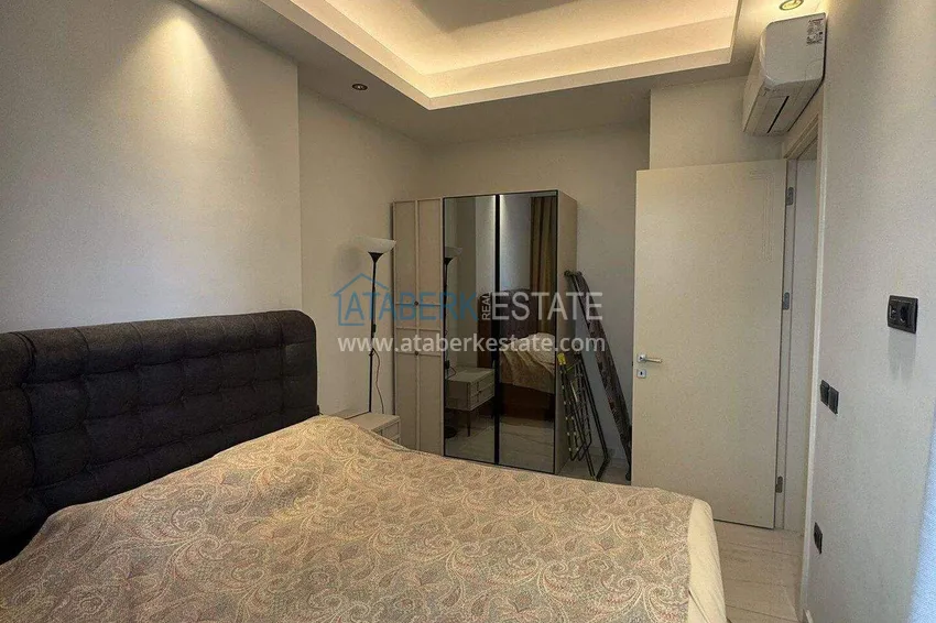 Kupuj  Apartament 1+1 w pierwszej linii w Mahmutlar — umeblowany i z widokiem na morze w pięciogwiazdkowym kompleksie hotelowym 6 