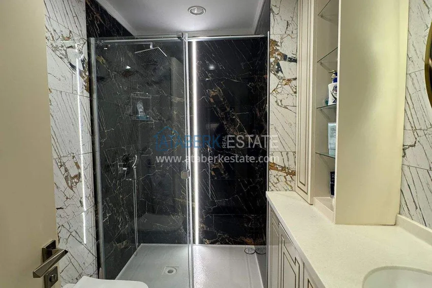 Kupuj  Apartament 1+1 w pierwszej linii w Mahmutlar — umeblowany i z widokiem na morze w pięciogwiazdkowym kompleksie hotelowym 7 