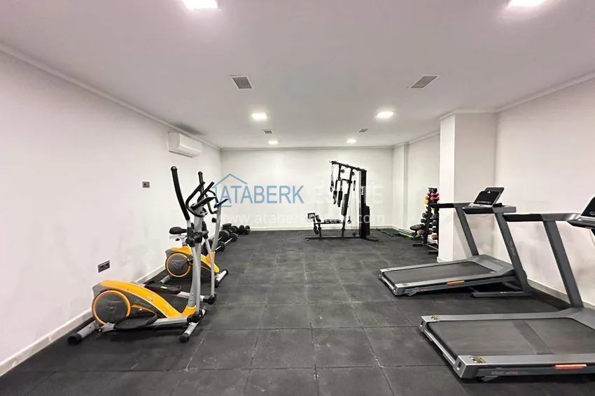 Wykończony apartament z dwiema sypialniami w kompleksie w budowie w Mahmutlar 12 
