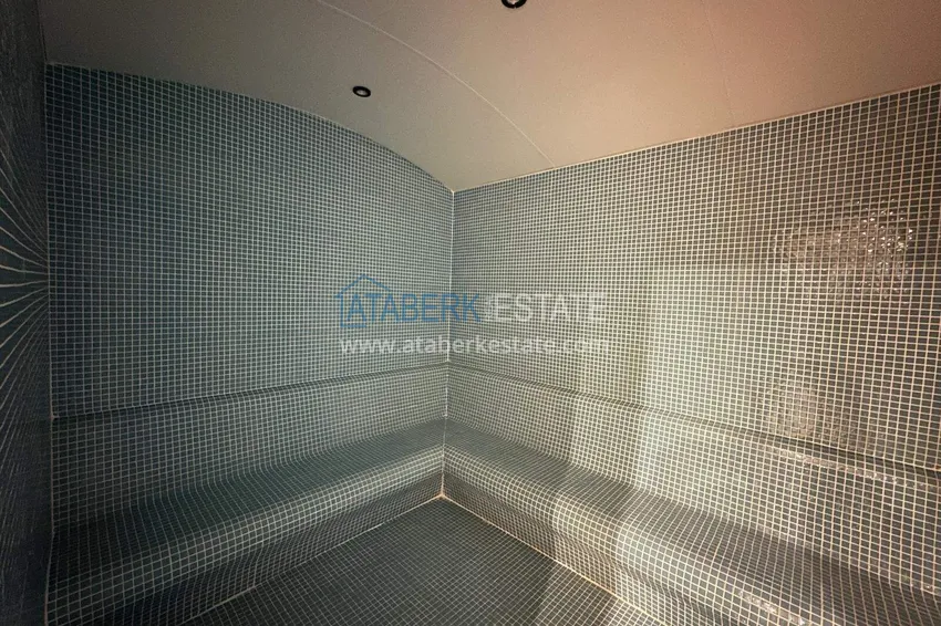 Wykończony apartament z dwiema sypialniami w kompleksie w budowie w Mahmutlar 14 