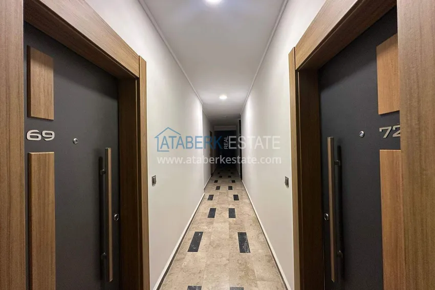 Wykończony apartament z dwiema sypialniami w kompleksie w budowie w Mahmutlar 16 