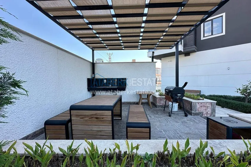 Wykończony apartament z dwiema sypialniami w kompleksie w budowie w Mahmutlar 7 