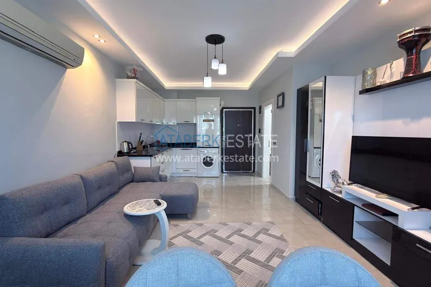 Kupuj Apartament 1+1 w centrum Mahmutlar - na 12. piętrze z meblami i widokiem na góry 2