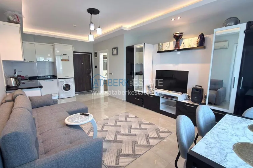 Kupuj Apartament 1+1 w centrum Mahmutlar - na 12. piętrze z meblami i widokiem na góry 3