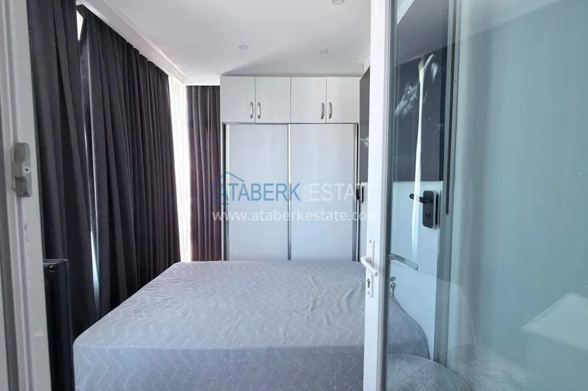 Kupuj Apartament 1+1 w centrum Mahmutlar - na 12. piętrze z meblami i widokiem na góry 7