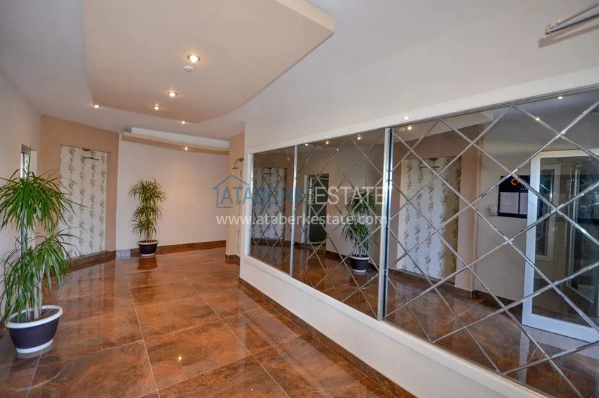 Apartament 1+1 70 m2 w Kestel — umeblowany, przeszklony balkon, 100 metrów od morza 14 