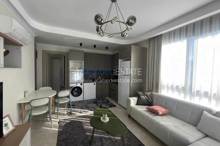 Kupuj  Apartament 1+1 z meblami w Cikcilli - nieruchomości w Alanyi na zezwolenie na pobyt 2 