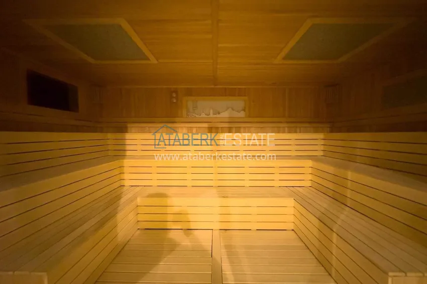 Przestronny apartament 1+1 w Turkler — 80 m2 umeblowany przez właściciela, ośrodek premium 74 