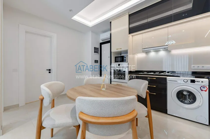 Kupuj  1+1 panoramiczny apartament w centrum Mahmutlar - luksusowe meble, morze w odległości spaceru 3 