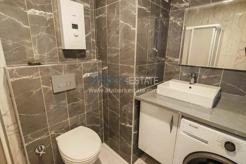 Kupuj  Nieruchomość w Alanyi z licencją na wynajem krótkoterminowy - apartament 1+1 w Avsallar 13 