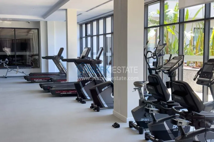 Nieruchomość w Alanyi - 1+1 85 m2 umeblowane mieszkanie w kompleksie wypoczynkowym premium, dzielnica Turkler 62 