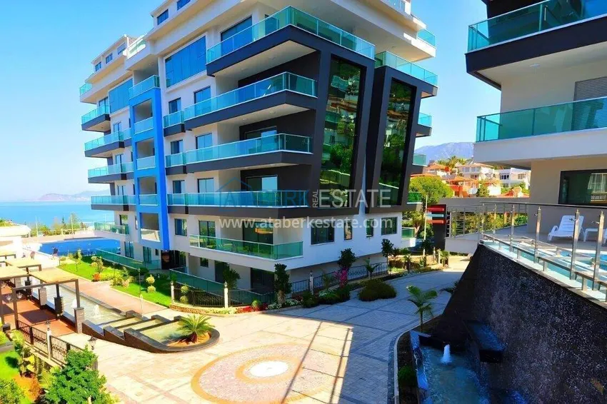 Apartament 2+1 na pierwszej linii w Alanyi, dzielnica Kargicak — meble, boczny widok na morze 24 