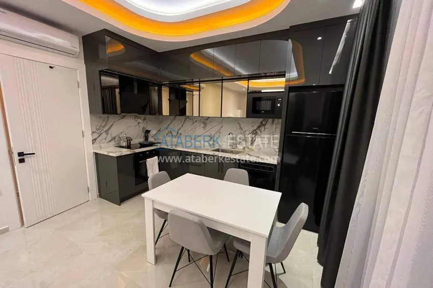 Kupuj  Apartament 2+1 w centrum Alanyi, umeblowany w luksusowym kompleksie, plaża Kleopatra  3 
