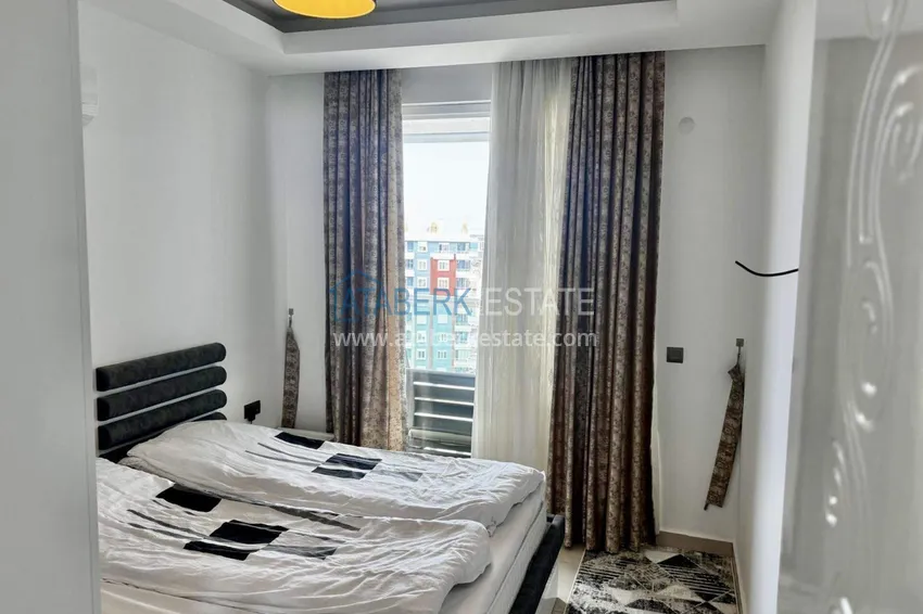 Kupuj  Apartament 1+1 w Tosmur, 76 m2 z meblami i widokiem na morze - nieruchomość na zezwolenie na pobyt w Alanyi  12 