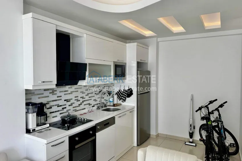 Kupuj  Apartament 1+1 w Tosmur, 76 m2 z meblami i widokiem na morze - nieruchomość na zezwolenie na pobyt w Alanyi  6 